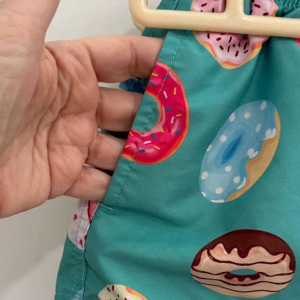 Vibrant Teal Kids Swim Trunks with Donut Design
